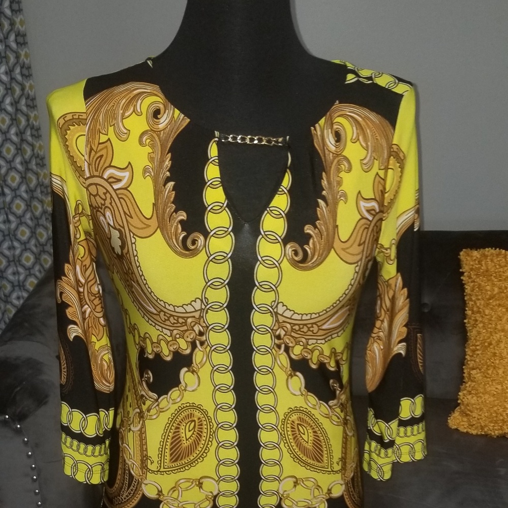 Gold and black dress with chain attached for detai